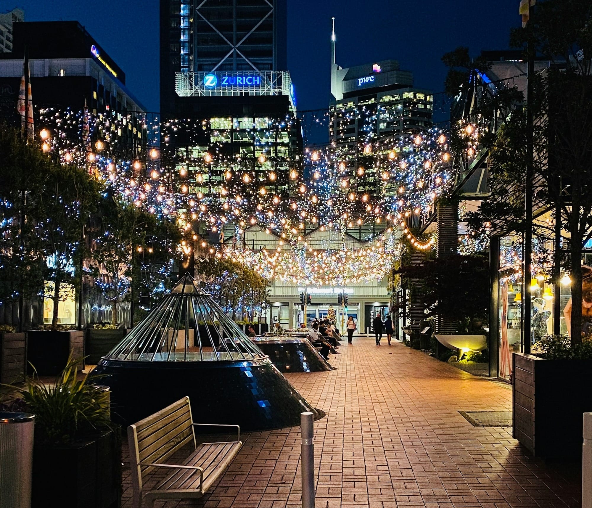 people walking on street during night time